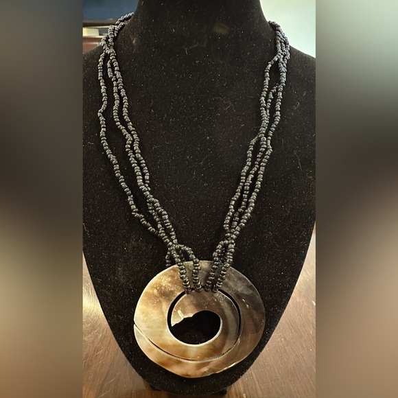Jewelry - Iridescent White Mother Of Pearl Pendant
With Black Beads